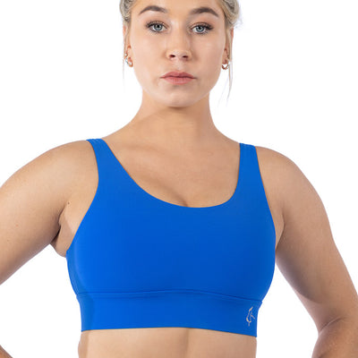 Front view of a blue sports bra for women featuring adjustable straps, thick under-band, and breathable VenaLux fabric.