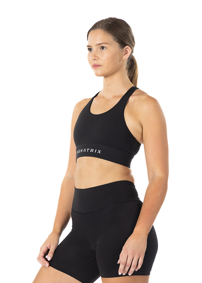 
                  
                    Left side view of black Venatrix Performance racerback sports bra showing contoured fit and moisture-wicking fabric.
                  
                