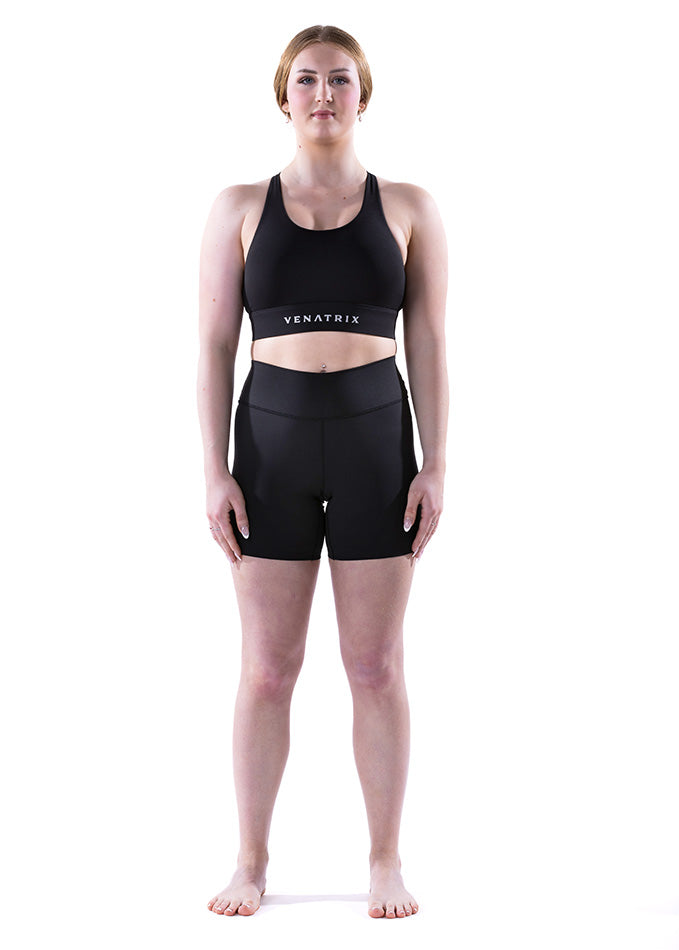 
                  
                    Full front view of Rhythm black shorts for women, featuring a streamlined silhouette and ergonomic cycling comfort.
                  
                