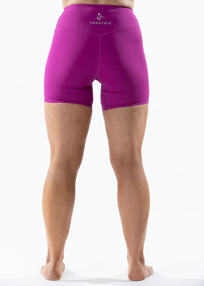 
                  
                    Back view of Rhythm pink bike shorts for girls, featuring sleek design and comfortable athletic fit.
                  
                